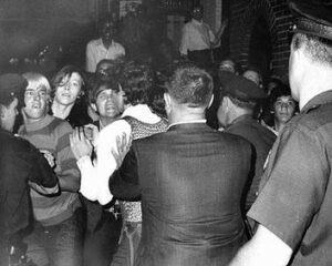 Police force people back outside the Stonewall Inn as tensions escalate the morning of June 28, 1969. Photographer: Joseph Ambrosini, New York Daily News