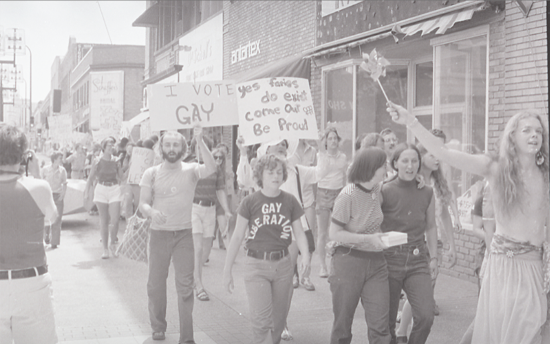 Photograph of a crowd marching on Gay Pride Day on June 28, 1975 in downtown Minneapolis. via: Minnesota Historical Society/John Hustad Papers/Tretter Collection in GLBT Studies/University of Minnesota