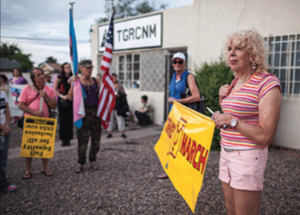 74 year old Army Veteran Denee Mallon, who had been denied sex reassignment surgery two years prior, holds a banner before taking part in the Trans March to Morningside Park in Albuquerque, N.M.. AP Images