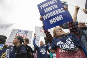 pro-LGBTQ protestors in front of the U.S. Supreme Court, Tuesday, Oct. 8, 2019, in Washington.